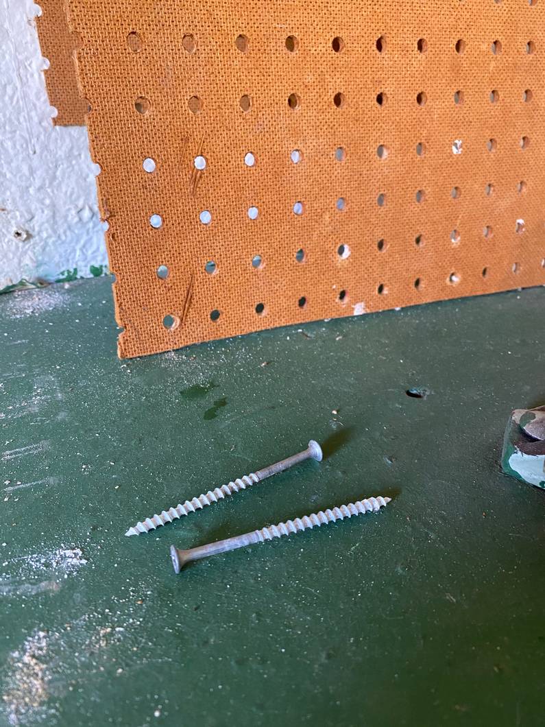 Screws that held up the pegboard